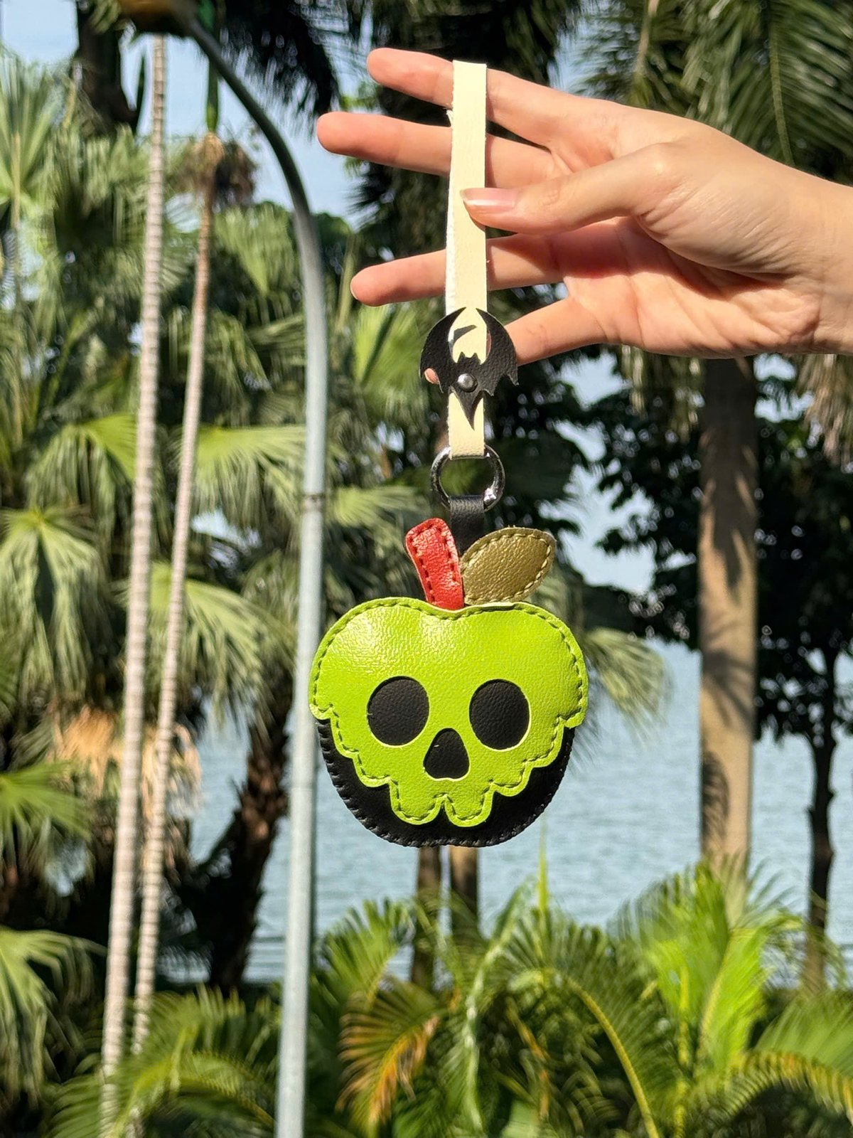 Poison Apple leather charm detail