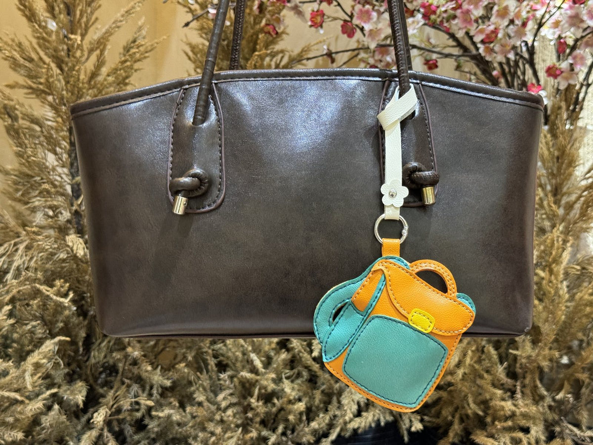 Backpack leather charm detail