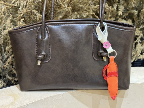 Pencil leather charm detail