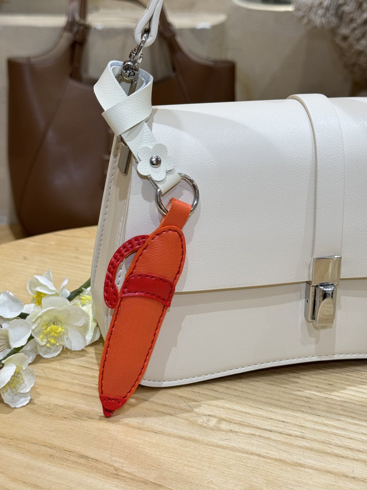 Pencil leather charm on bag